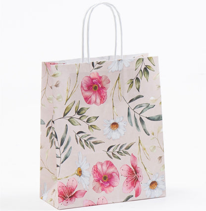 Mit Blumemotiv bedruckte Papierkordeltasche mit weißen Papierkordeln ideal als Geschenkverpackung