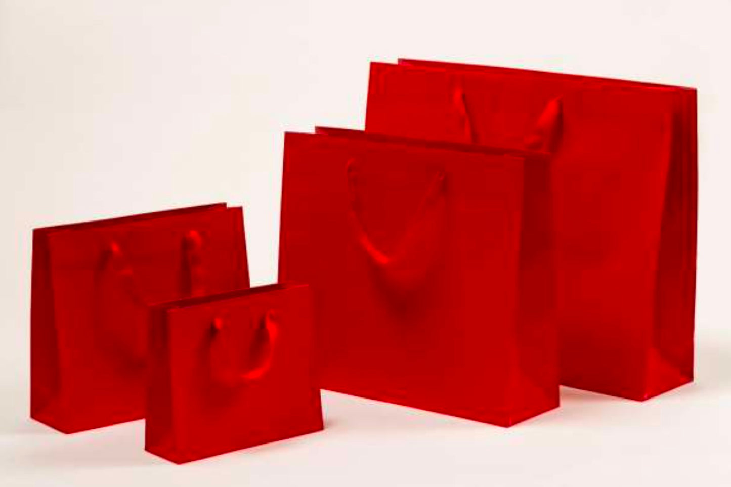 Premium Papiertragetasche mit Stoffbändern in Rot
