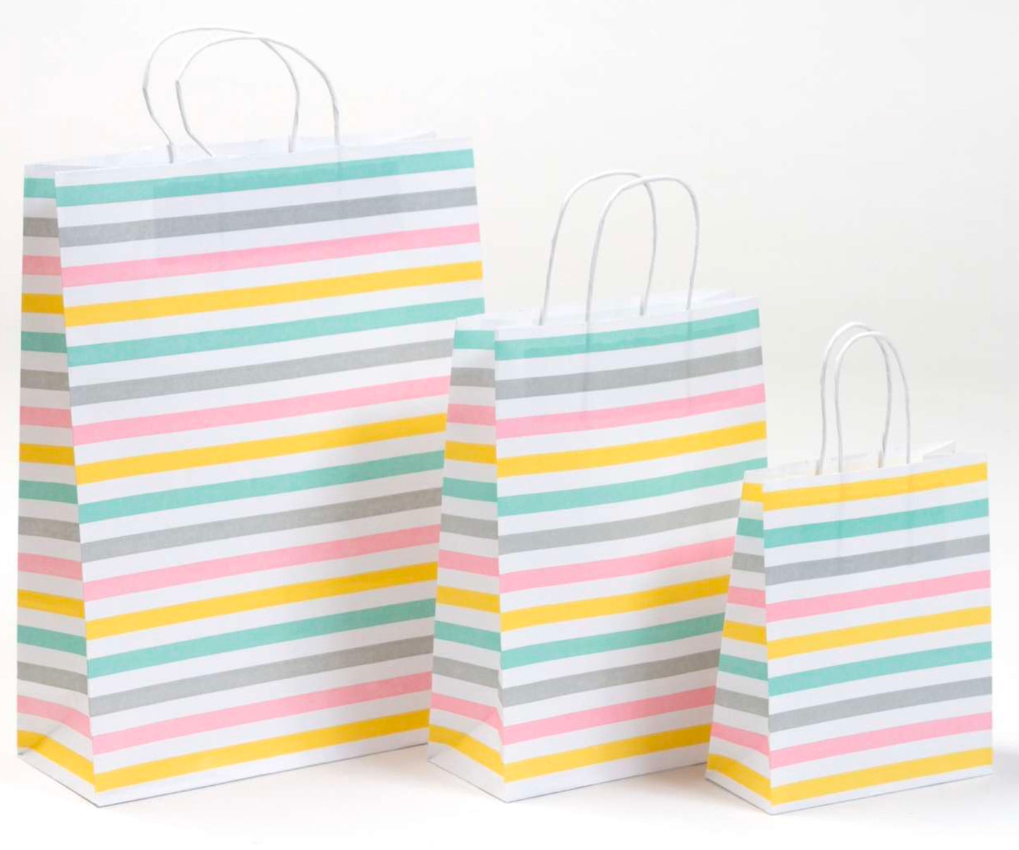 Mit bunten Streifen bedruckte Papierkordeltaschen in weiß, stabil. Geschenktaschen, fröhliches Streifen-Motiv, 3 Größenformate von Max Josef Steinebach GmbH